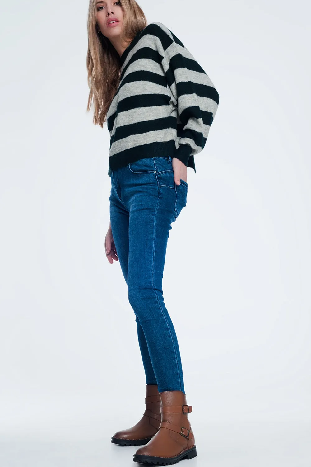 Green knitted sweater with grey stripes
